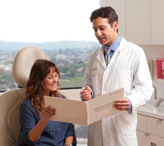 Dr. Michael K. Newman consulting with a patient